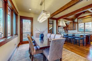 a dining room and kitchen with a table and chairs at Mountain Breeze Retreat in Edwards