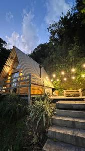 a house with stairs leading up to it at Cabanas Bela Vista in Rolante