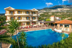 a view of a hotel with a swimming pool at Marina-Anna Studios in Trapezaki