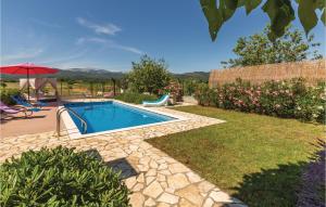 a swimming pool in a yard with a patio at Holiday Home Prolozac Donji 12 in Donji Proložac +33 photos