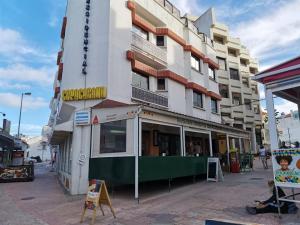 a building with a sign on the side of it at Copacabana Residencial in Costa da Caparica