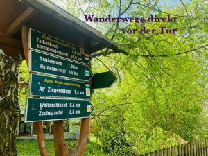 a street sign with several signs on it at Am Schloss Wolkenstein, 86m2, 3BR, Babybett, Office in Wolkenstein