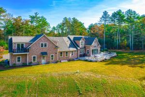 a large brick house with a large yard at IL CAMPO in Plymouth