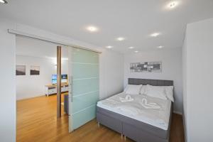 Ένα ή περισσότερα κρεβάτια σε δωμάτιο στο book2stay - Lakeview Apartment