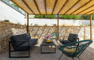 a patio with two chairs and a table at Villa Stora Kuca in Krapan +50 photos