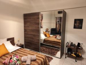 a bedroom with a large mirror on the wall at ViP in Veria