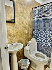 a bathroom with a toilet and a sink at Casa Centro Historico Hotel in Cartagena de Indias
