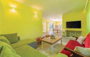 a living room with a couch and a table at Beautiful Home In Vodnjan With Kitchen in Vodnjan