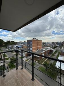 a view of a city from a balcony at HostelFC JVargas in Bogotá