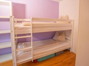 A bed or beds in a room at Rosenberger II