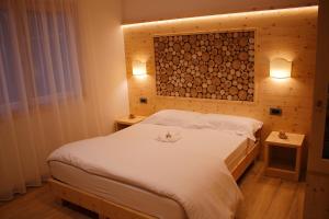 Ένα ή περισσότερα κρεβάτια σε δωμάτιο στο B&B Augusto