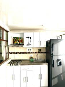 Dapur atau dapur kecil di Cálido apartamento +8 gambar