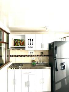 Dapur atau dapur kecil di Cálido apartamento