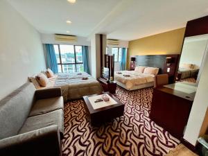 Ένα ή περισσότερα κρεβάτια σε δωμάτιο στο Faina Homestay SCSP Ming Resident