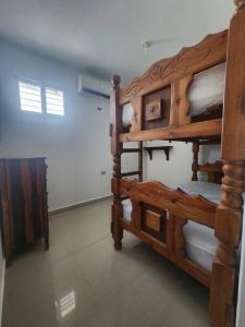 two sets of bunk beds in a room at Apartamento soñado de Playa in El Marite +1 photo
