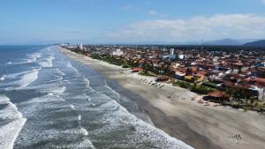 an aerial view of a beach with a city at Pousada Amarela Beach in Itanhaém
