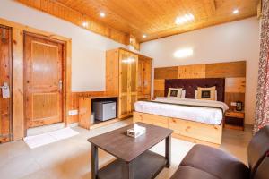 Ένα ή περισσότερα κρεβάτια σε δωμάτιο στο Hotel Cherry Manali