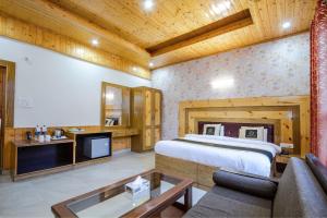 Ένα ή περισσότερα κρεβάτια σε δωμάτιο στο Hotel Cherry Manali