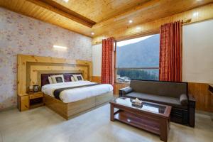 Ένα ή περισσότερα κρεβάτια σε δωμάτιο στο Hotel Cherry Manali