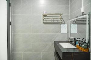 a bathroom with a sink and a mirror at TP-HOMES PHAN THIẾT in Phan Thiet +104 photos