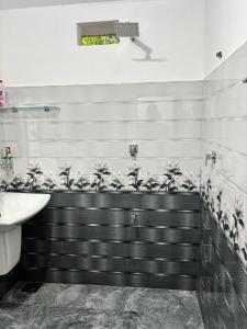a bathroom with a sink and a toilet at VN45 Villa in Ahangama in Ahangama