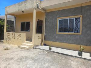 a house is being constructed with the door open at Marion's incredible 1 bedroom apartment in Watamu