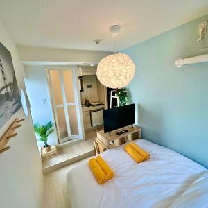 Postel nebo postele na pokoji v ubytování PLAZA SINJUKU Cozy Mansion