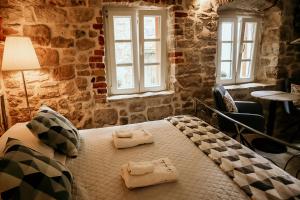 Кровать или кровати в номере City Rooms Šibenik