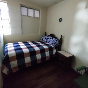 Postel nebo postele na pokoji v ubytování Conexión Urbana en el centro de Ambato