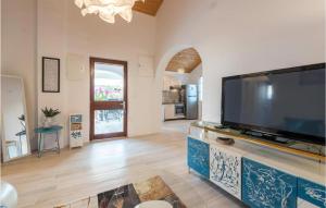 a living room with a large flat screen tv at Pet Friendly Home In Potocnica in Potocnica