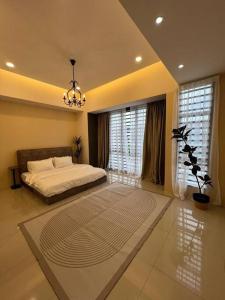 En eller flere senge i et værelse på Rumah Saujana KLIA