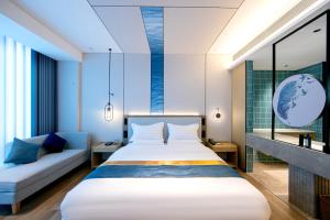 Voodi või voodid majutusasutuse Chaozhou Yuyu Hotel toas