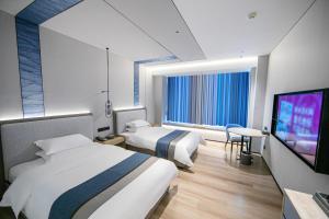 Televiisor ja/või meelelahutuskeskus majutusasutuses Chaozhou Yuyu Hotel