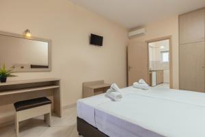 Voodi või voodid majutusasutuse Yakinthos Hotel toas