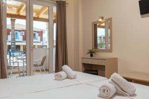 Voodi või voodid majutusasutuse Yakinthos Hotel toas
