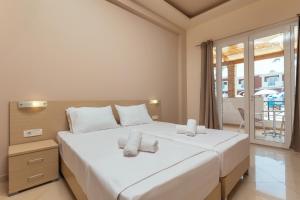 Voodi või voodid majutusasutuse Yakinthos Hotel toas