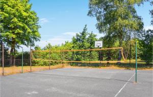 a basketball hoop with a net on a court at Cozy Apartment In Ustka With Wifi in Ustka