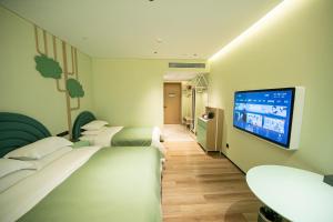 Televiisor ja/või meelelahutuskeskus majutusasutuses Chaozhou Yuyu Hotel