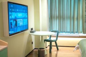Televiisor ja/või meelelahutuskeskus majutusasutuses Chaozhou Yuyu Hotel