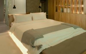 Voodi või voodid majutusasutuse Wangshan Life Diaoxueyuan Design Hotel toas