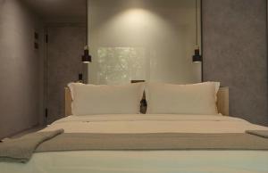 Voodi või voodid majutusasutuse Wangshan Life Diaoxueyuan Design Hotel toas