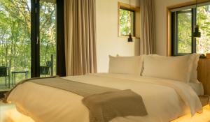 Voodi või voodid majutusasutuse Wangshan Life Diaoxueyuan Design Hotel toas
