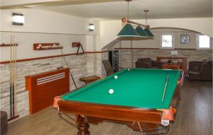 a pool table in a living room with a pool table at Nice Home In Kotor With Sauna in Kotor