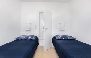 Postel nebo postele na pokoji v ubytování Pet Friendly Home In Punat With Kitchen