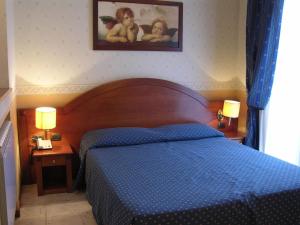 Posteľ alebo postele v izbe v ubytovaní Hotel Verona Rome
