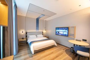 Voodi või voodid majutusasutuse Chaozhou Yuyu Hotel toas