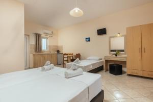 Voodi või voodid majutusasutuse Yakinthos Hotel toas