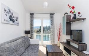 TV a/nebo společenská místnost v ubytování Apartment Blace With Sea View Xiii