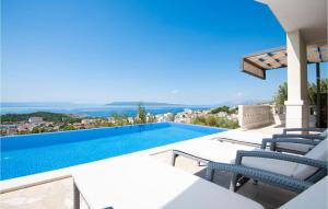 a villa with a swimming pool with a view at Amazing Home In Makarska in Makarska +51 photos