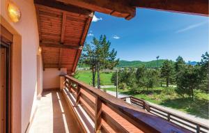 a balcony of a house with a large window at Pet Friendly Home In Vrata With Sauna in Vrata +29 photos